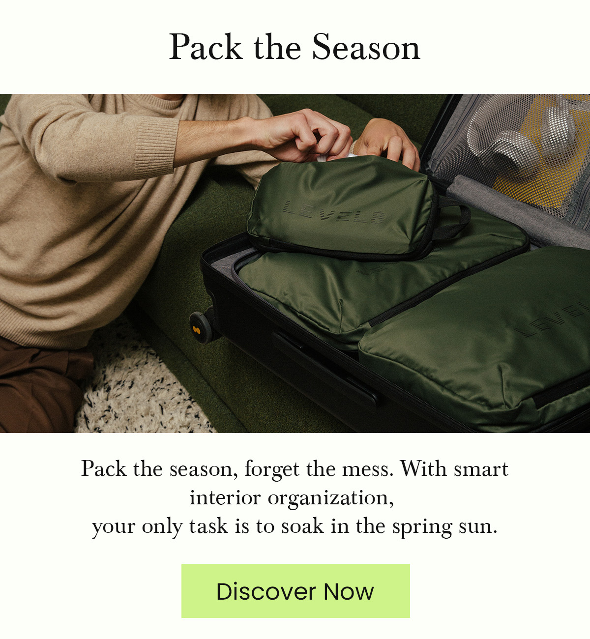 Close-up of a traveler organizing green LEVEL8 packing cubes into a black suitcase. Text: Pack the season, forget the mess.
